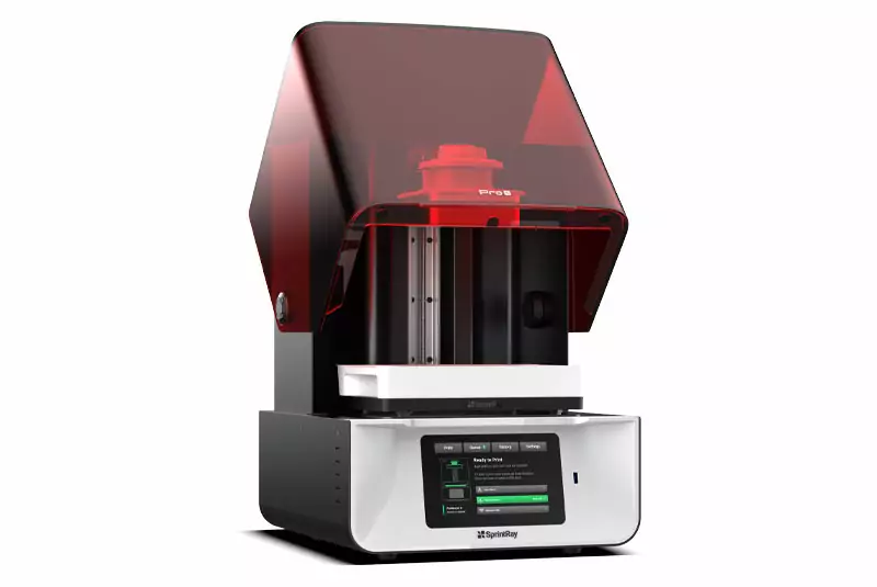 A high-tech 3D printer with a sleek black and white design, featuring a red-tinted cover and digital control panel displaying print settings.